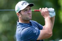 Jon Rahm watches his tee shot on the 3rd hole during the first round of the Wells Fargo Champio ...