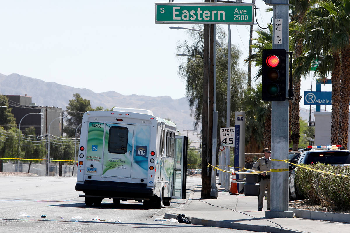 Police investigate a crash involving a bus and a pedestrian Tuesday, May 4, 2021, at the inters ...