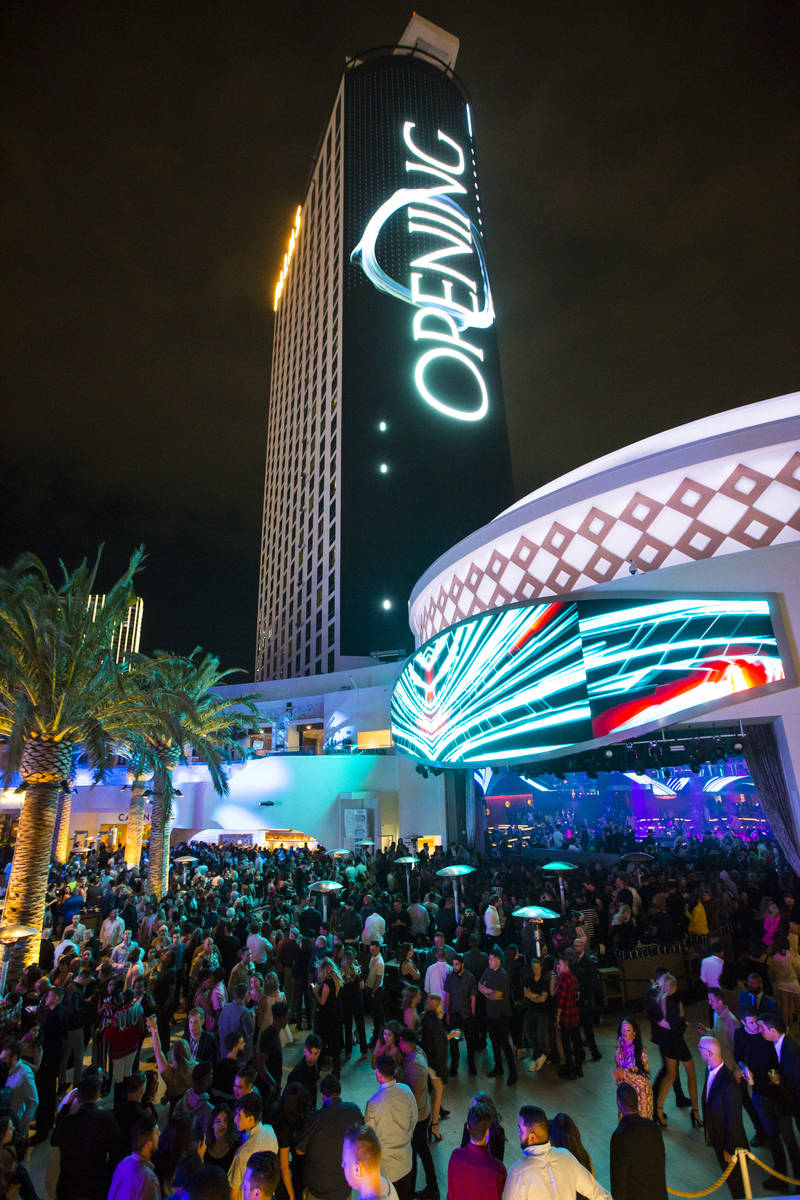 Attendees roam the outdoor area the during the grand opening weekend of Kaos, the new dayclub a ...