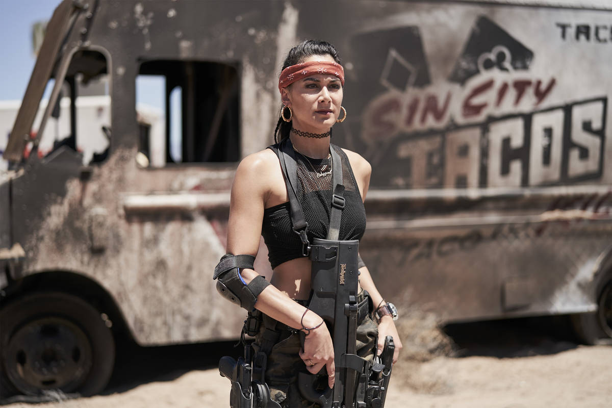Actress Samantha Win stands in front of a burned out Sin City Tacos truck on the set of "Army o ...