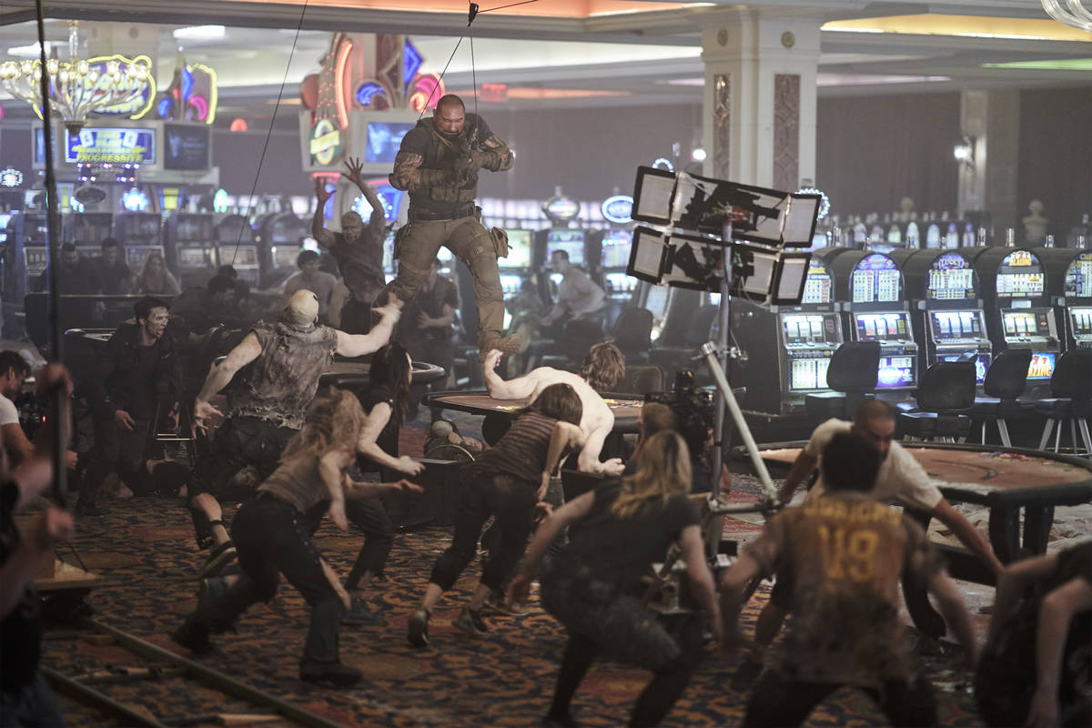 Dave Bautista battles a casino filled with zombies while filming a scene from "Army of the Dead ...