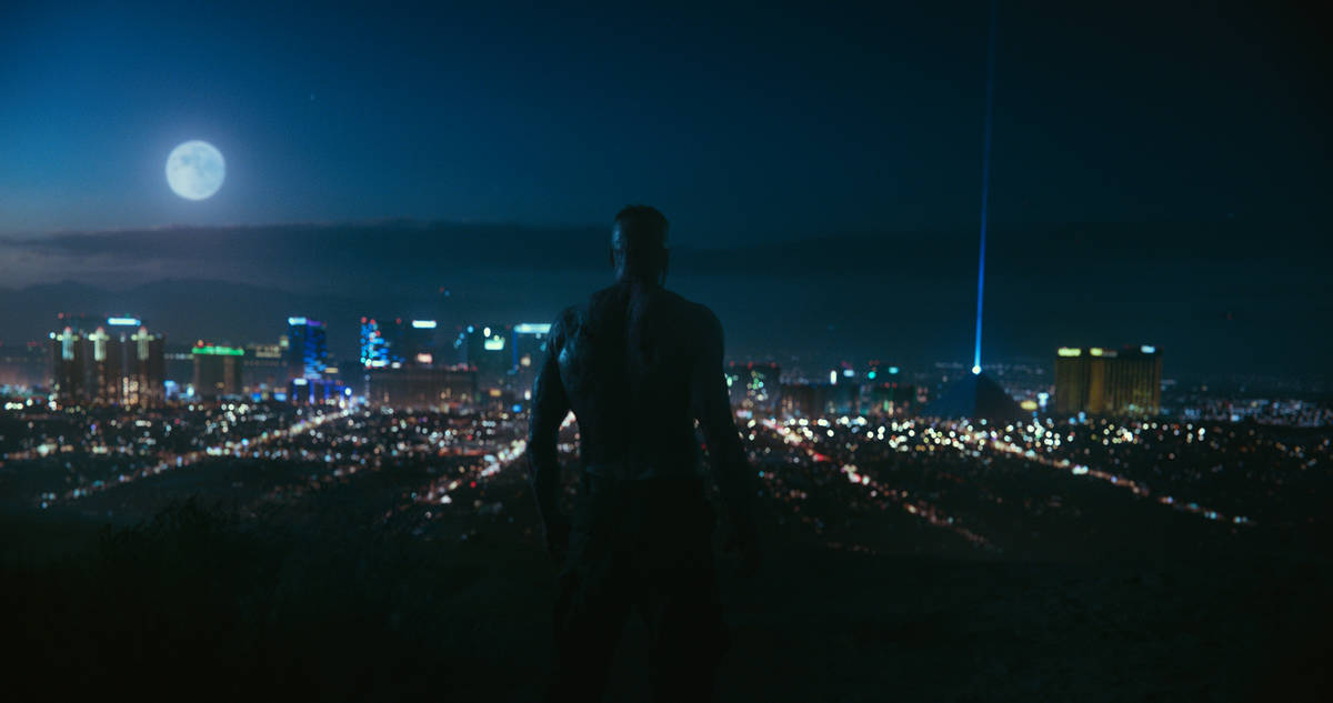 An escaped zombie looks out at the Las Vegas skyline in a scene from "Army of the Dead." (Netflix)