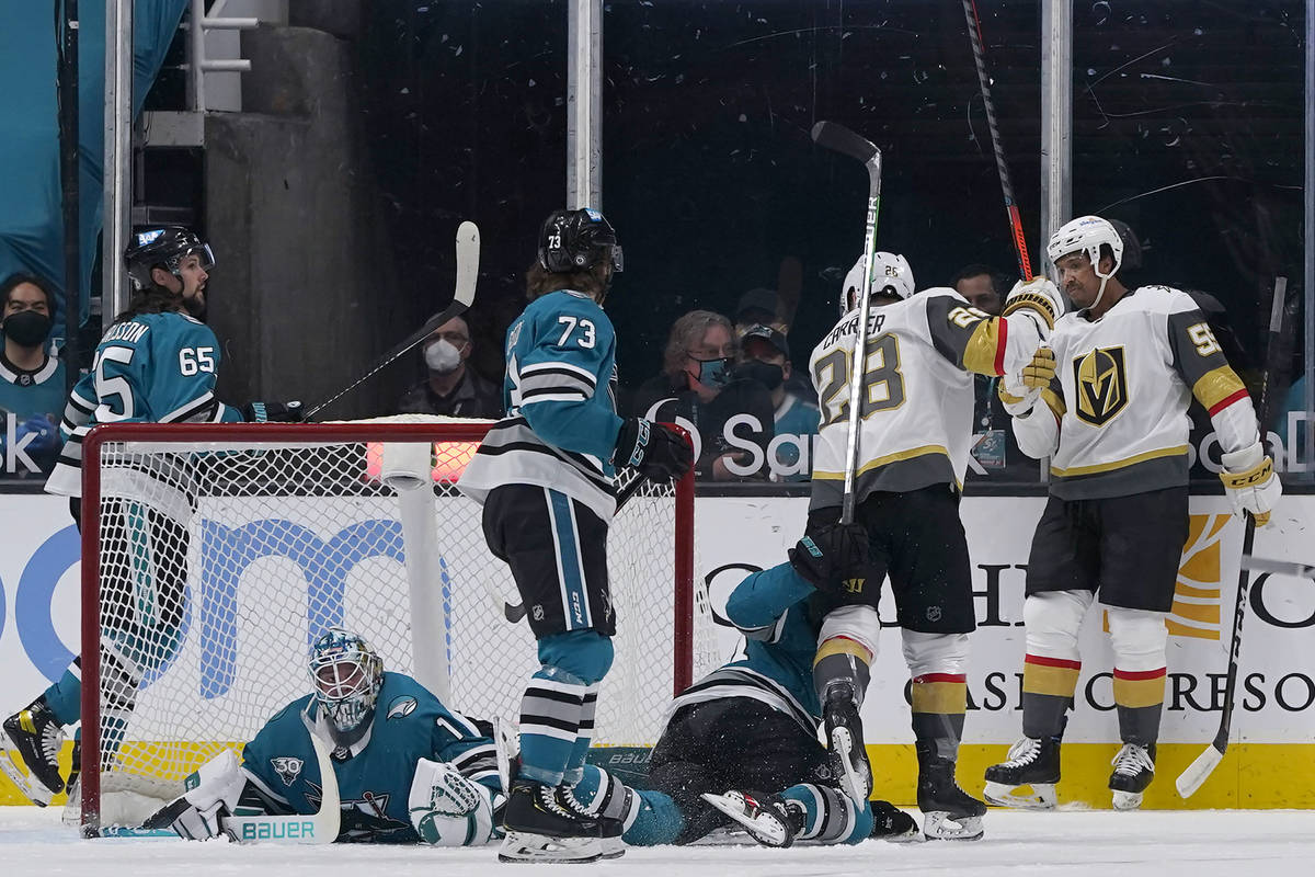 Vegas Golden Knights right wing Keegan Kolesar, right, is congratulated by left wing William Ca ...