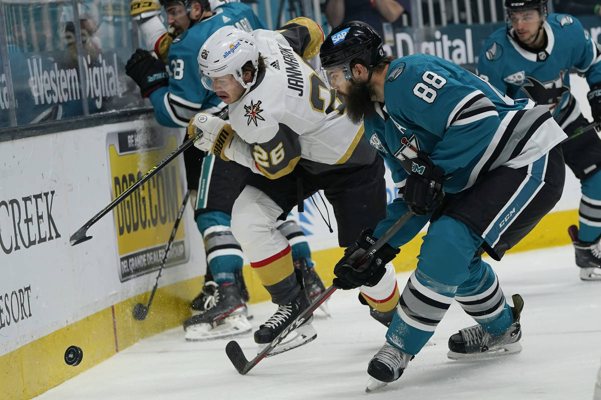 Vegas Golden Knights center Mattias Janmark (26) and San Jose Sharks defenseman Brent Burns (88 ...