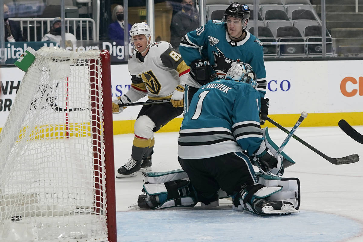 Vegas Golden Knights center Jonathan Marchessault, left, looks toward the goal after scoring pa ...