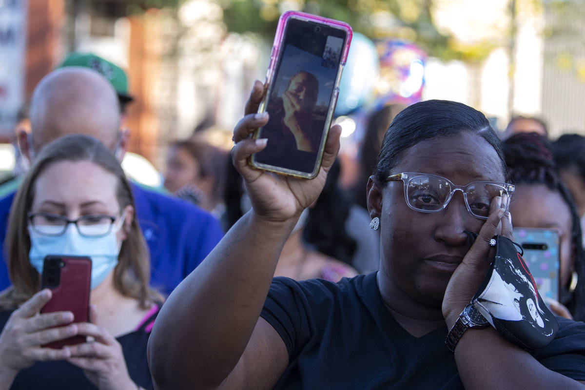 Arielle Mathews, a close friend of Amari Nicholson's grandmother, holds her on a video call dur ...