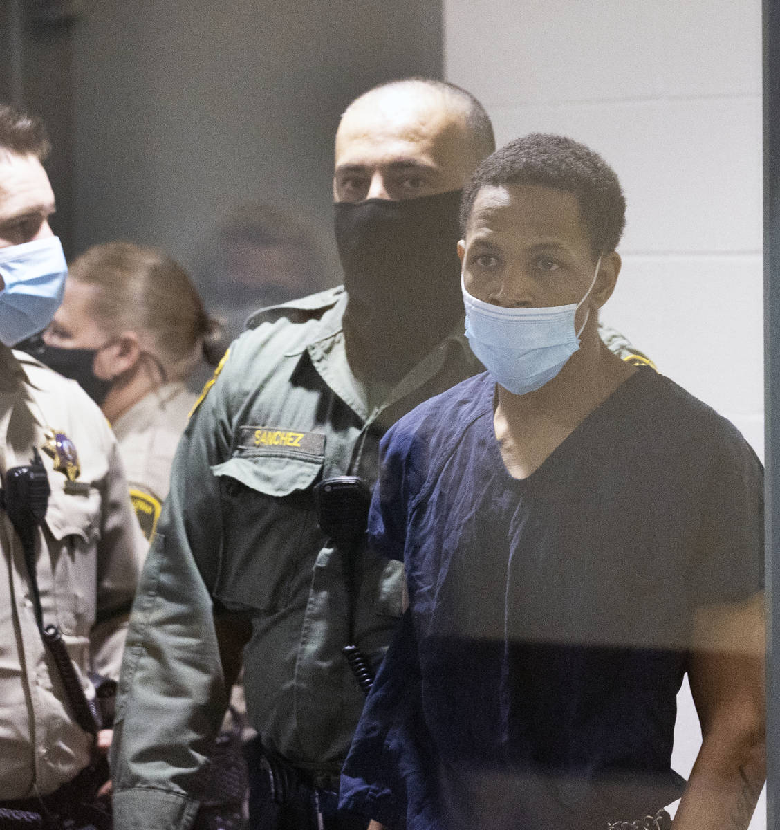 Terrell Rhodes, charged in the death of 2-year-old boy, Amari Nicholson, led into the courtroom ...