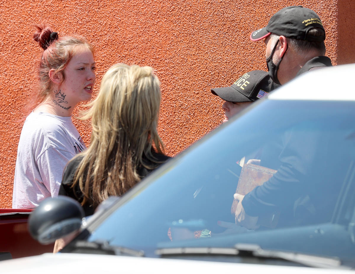 Tayler Nicholson, mother of missing Las Vegas toddler Amari Nicholson, talks to police near the ...