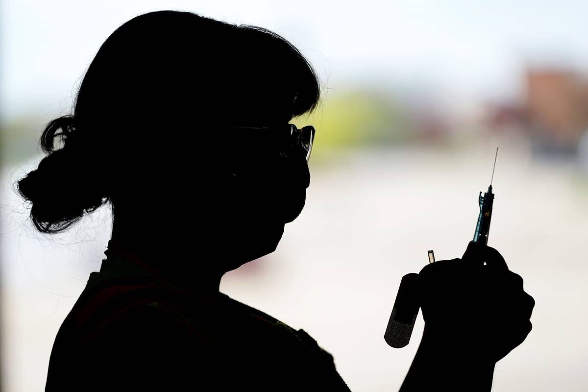 Sterling Heights firefighter Ashley Brouwer, who started her job in March 2021, prepares a syri ...