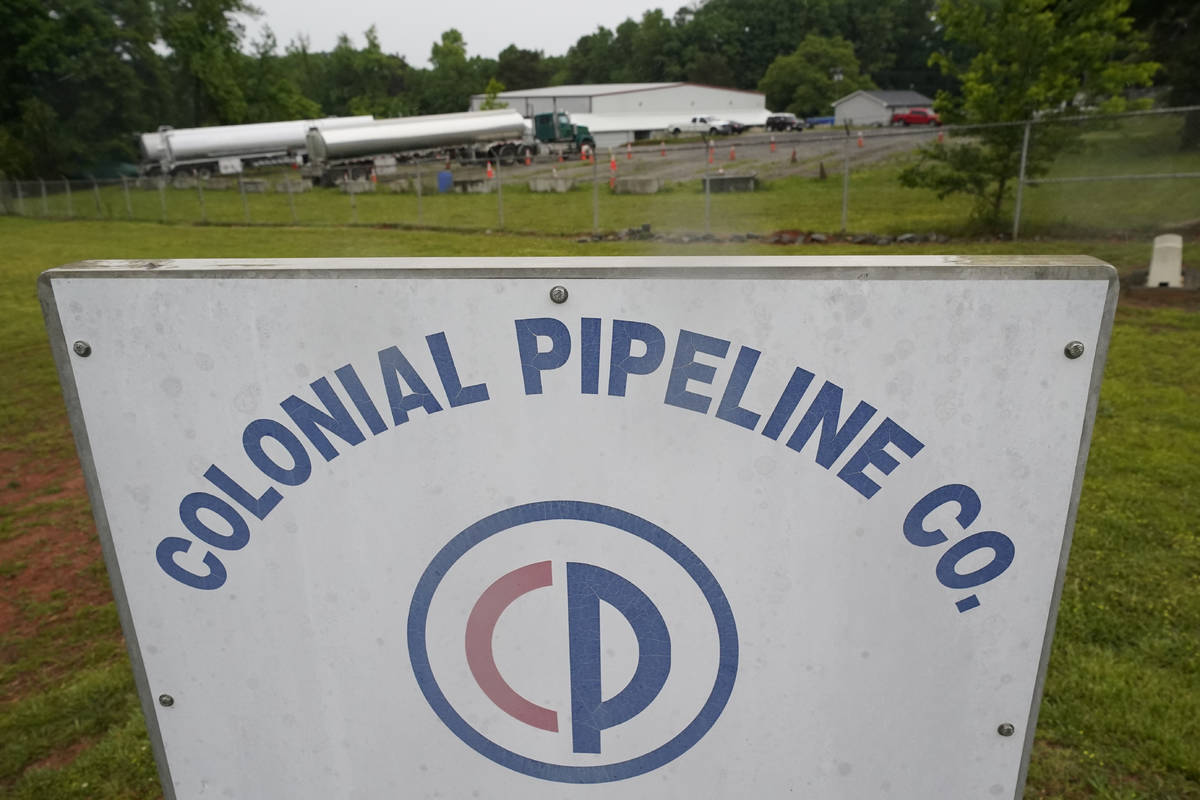 Tanker trucks are parked near the entrance of Colonial Pipeline Company Wednesday, May 12, 2021 ...