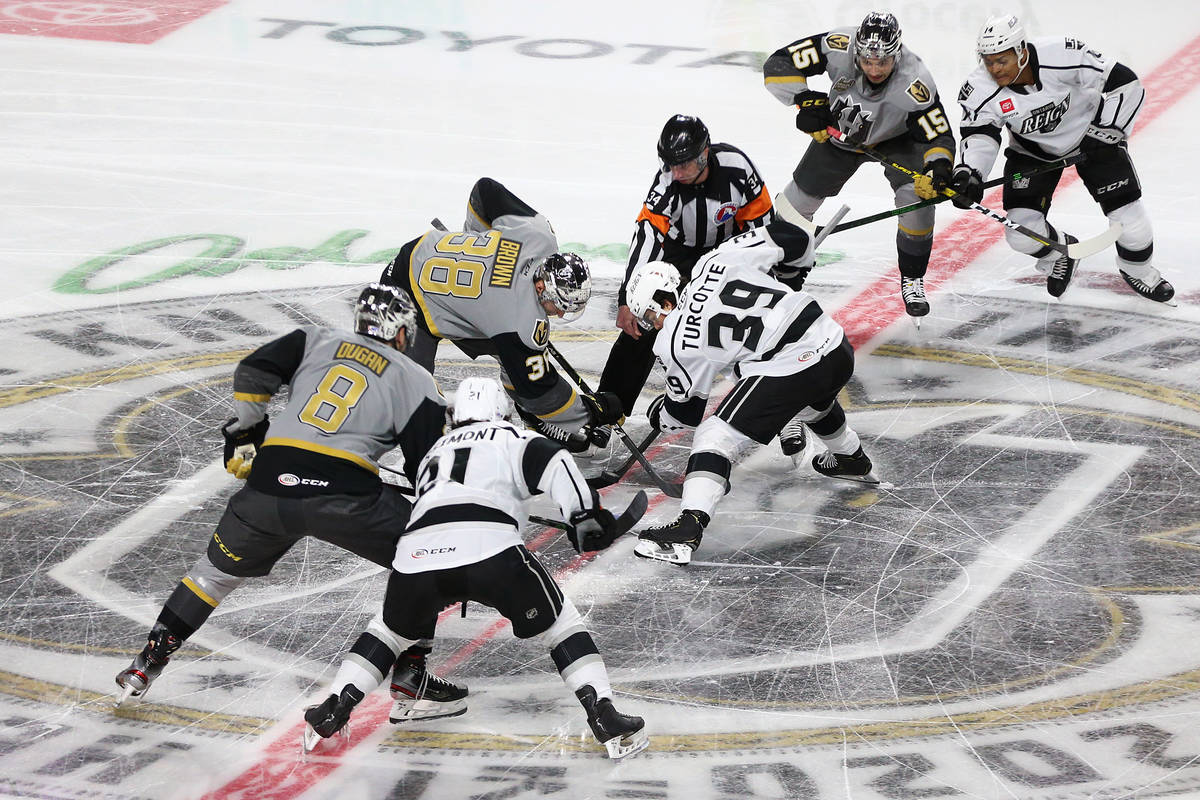 The puck drops to start the game between the Henderson Silver Knights and the Ontario Reign dur ...
