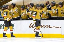 Golden Knights left wing Max Pacioretty (67) and Golden Knights right wing Mark Stone (61) fist ...