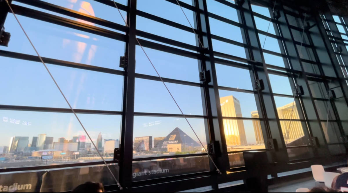 View looking out Allegiant Stadium's lanai doors toward the Las Vegas Strip. (Mick Akers/Las Ve ...