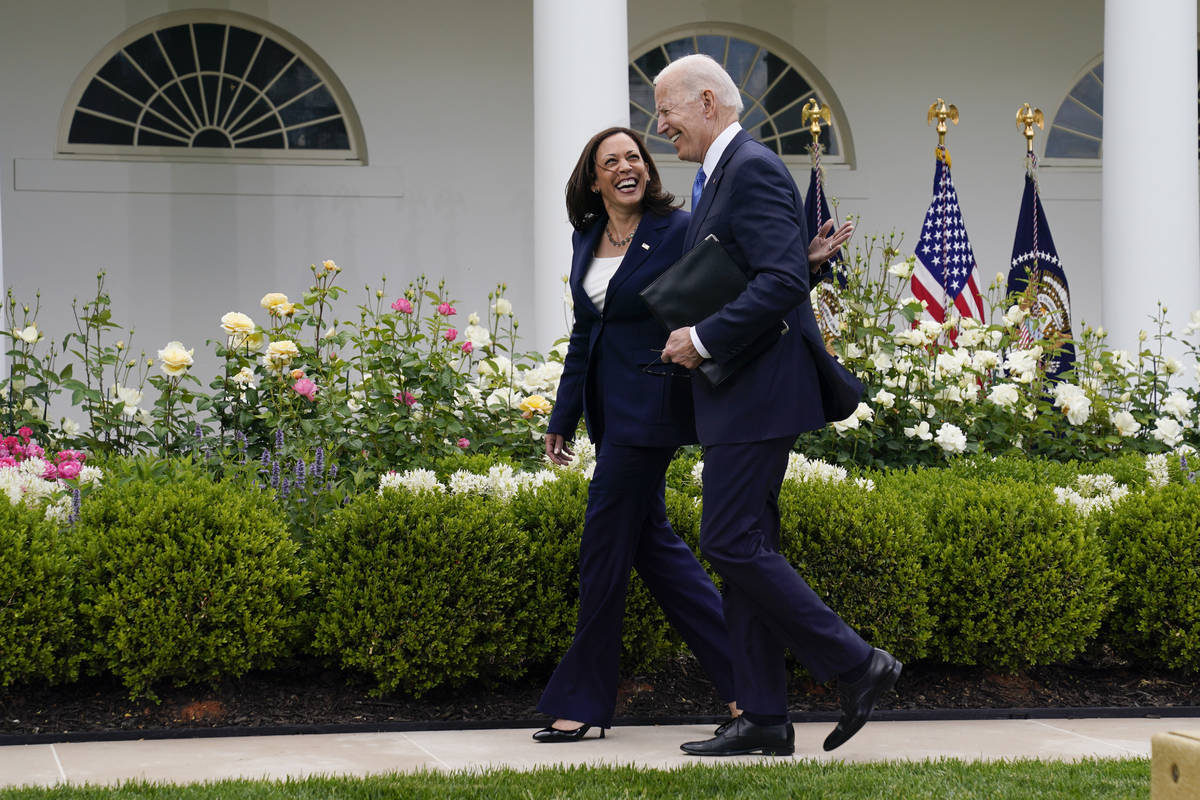 President Joe Biden walks with Vice President Kamala Harris after