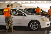 Nevada National Guardsmen begin to give injections during a preview of the new drive-through CO ...