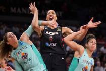 Las Vegas Aces center Liz Cambage (8) fights for position with New York Liberty center Amanda Z ...