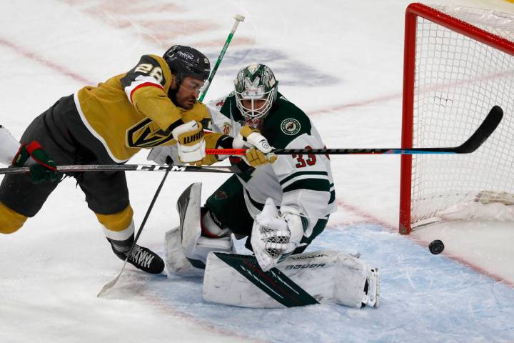 Vegas Golden Knights left wing William Carrier (28) tries to shoot agains Minnesota Wild goalte ...