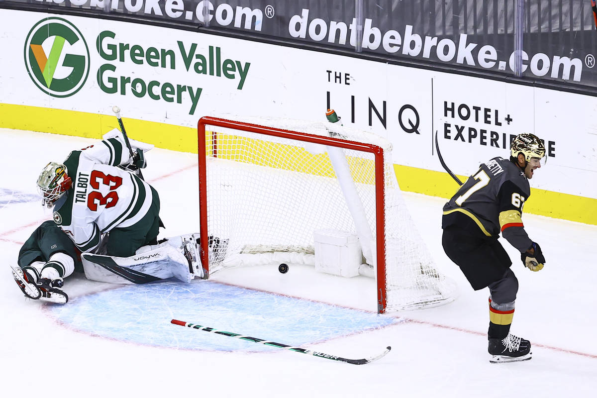 Golden Knights left wing Max Pacioretty (67) scores a goal in overtime past Minnesota Wild goal ...