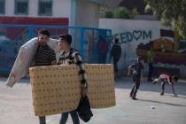 Palestinians take shelter provided by the U.N. at a school after fleeing their homes from the o ...