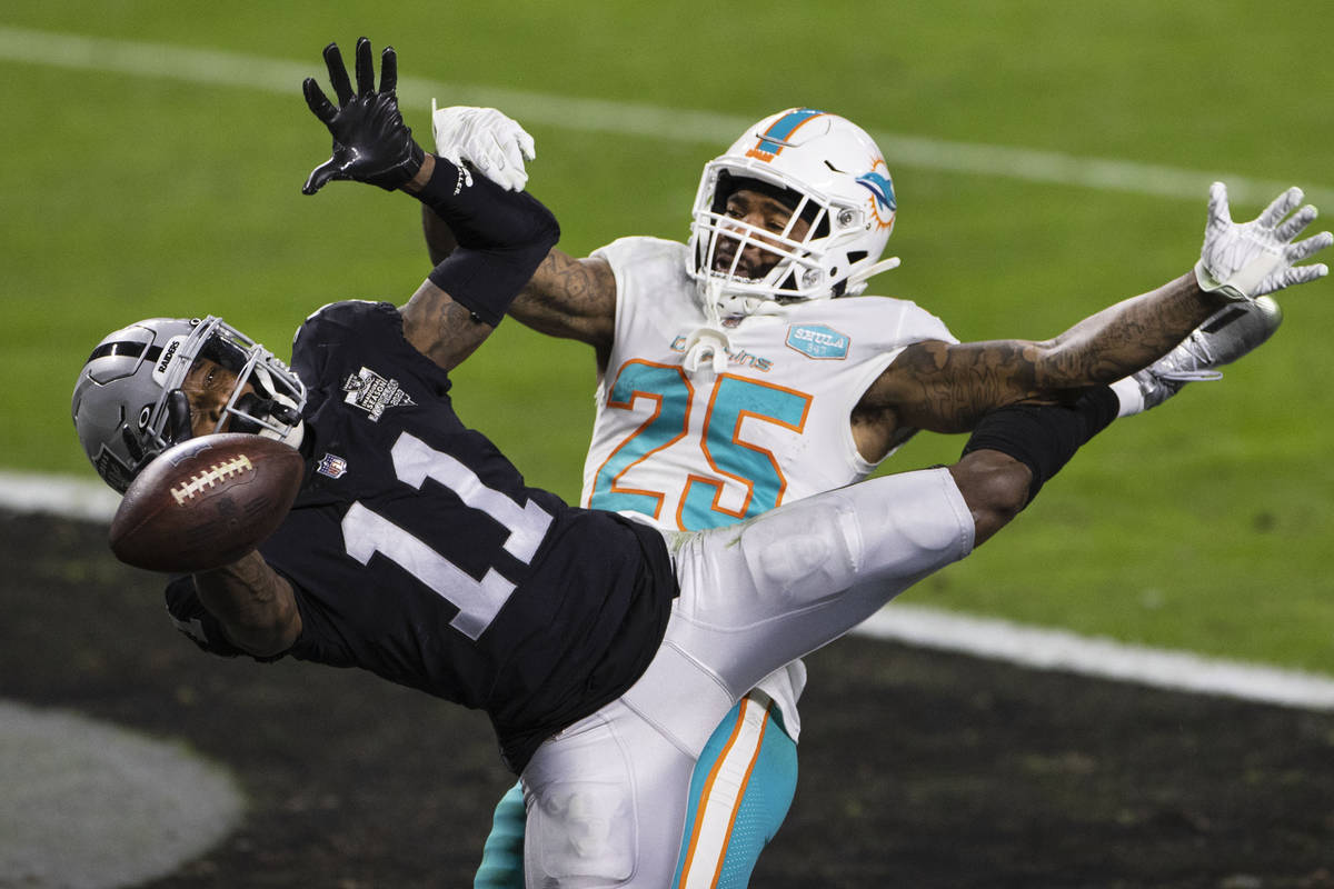 Raiders wide receiver Henry Ruggs III (11) is unable to catch the ball as Miami Dolphins corner ...