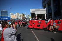 People attend the SEMA show at the Las Vegas Convention Center in Las Vegas, Tuesday, Nov. 5, 2 ...