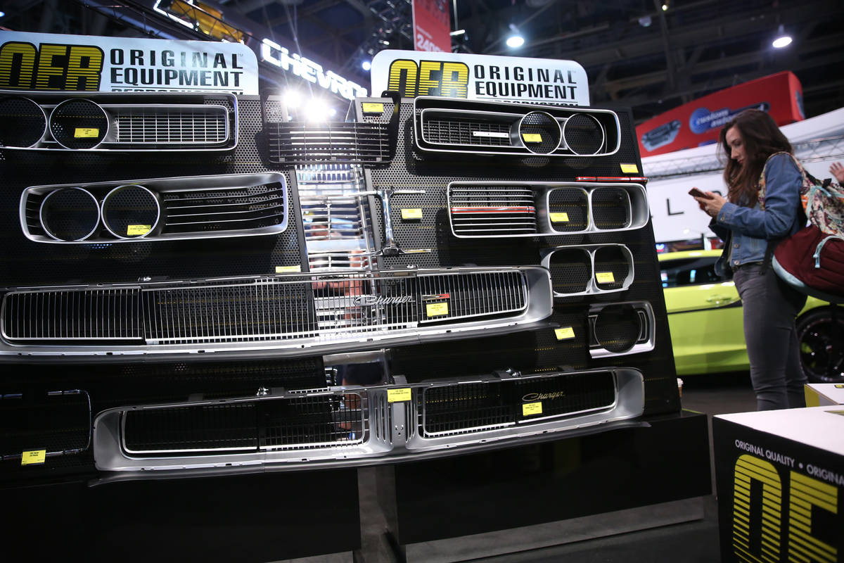 Car parts on display at the Original Equipment Reproduction booth during the SEMA show at the L ...