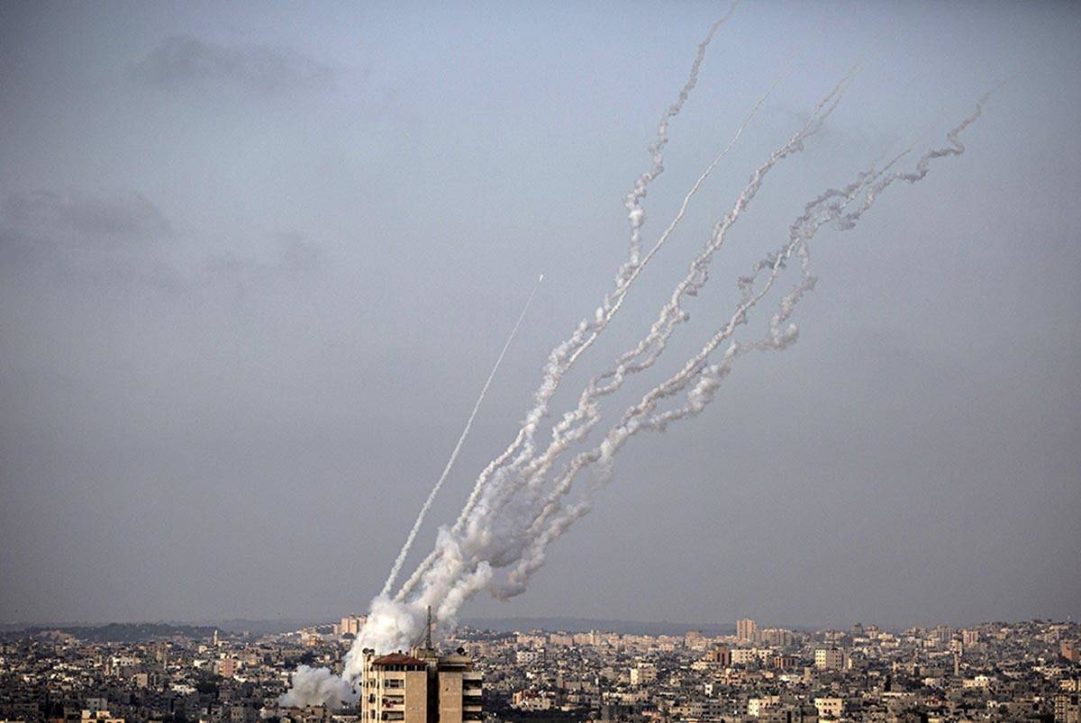 Rockets are launched from the Gaza Strip toward Israel, Monday, May. 10, 2021. (AP Photo/Khalil ...