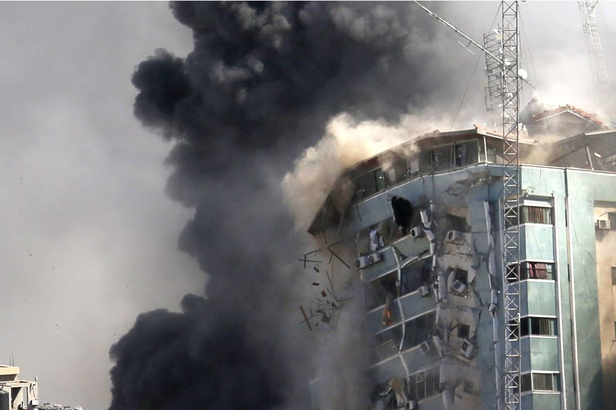 The building housing the offices of The Associated Press and other media in Gaza City collapses ...