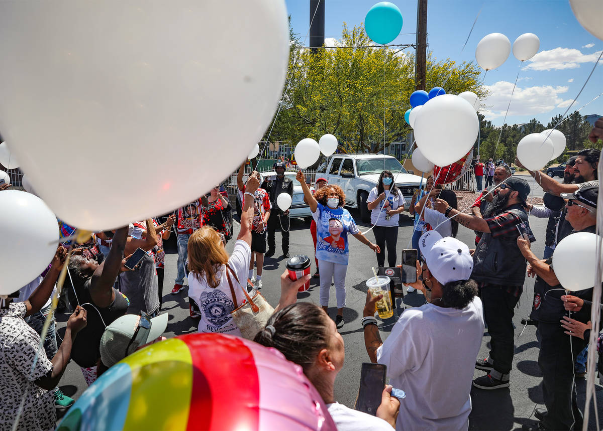 Zak Ramons, center, aunt to Amari Nicholson, leads a balloon release in honor of Amari, the 2-y ...