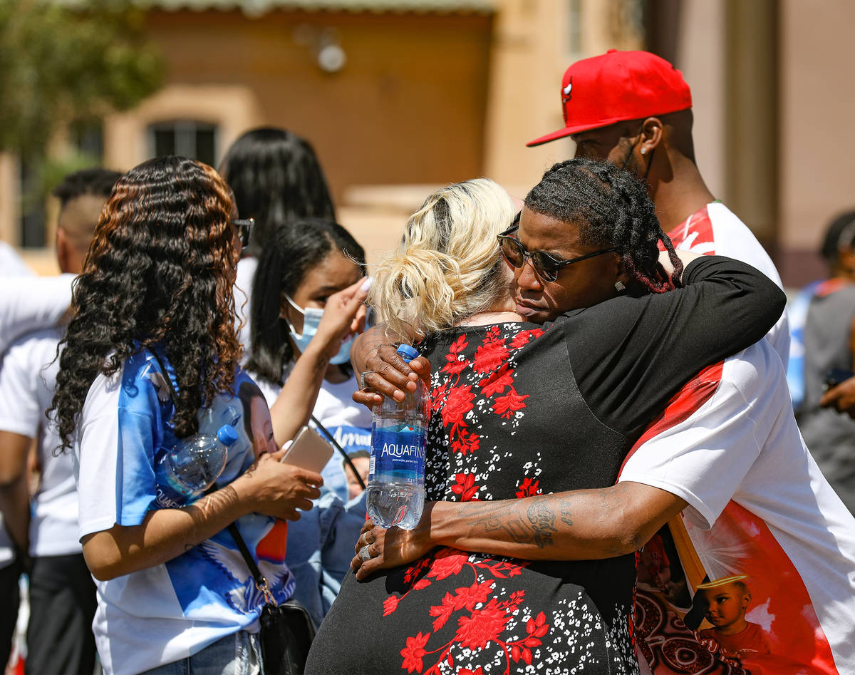 Erica Hayes, left, hugs Jyrgio Hayes, right, her brother-in-law and father to 2-year-old Amari ...