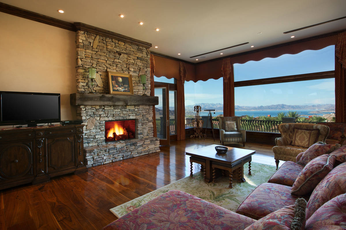 The living room, with Lake Mead in the distance, at 106 Stone Canyon Court in Boulder City. (Jo ...