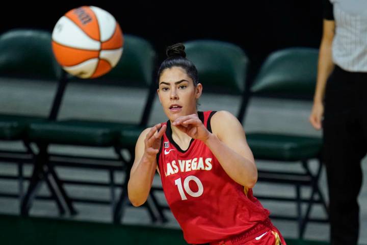 Las Vegas Aces' Kelsey Plum reaches for the ball during the first half of a WNBA basketball gam ...