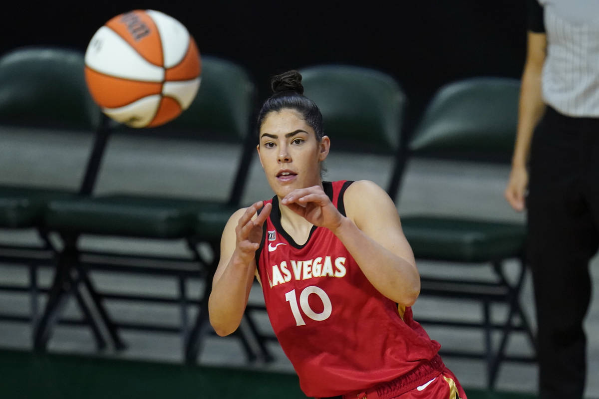 Las Vegas Aces' Kelsey Plum reaches for the ball during the first half of a WNBA basketball gam ...