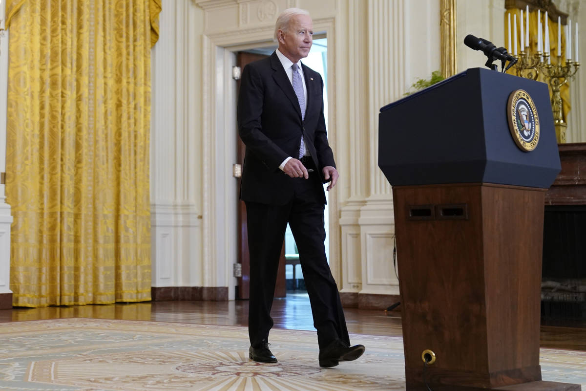President Joe Biden arrives to speak about distribution of COVID-19 vaccines, in the East Room ...
