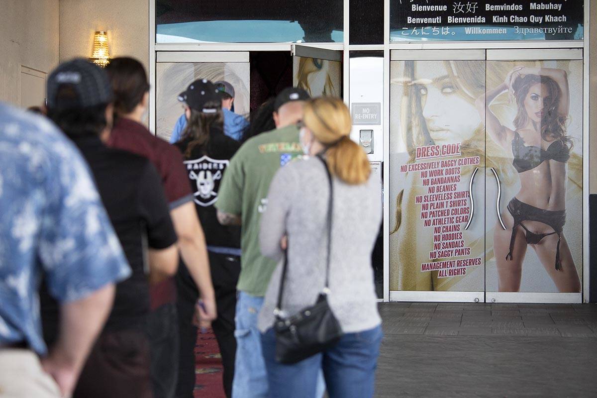 Vaccine seekers wait in line for a pop-up COVID-19 vaccine clinic put on by the Southern Nevada ...