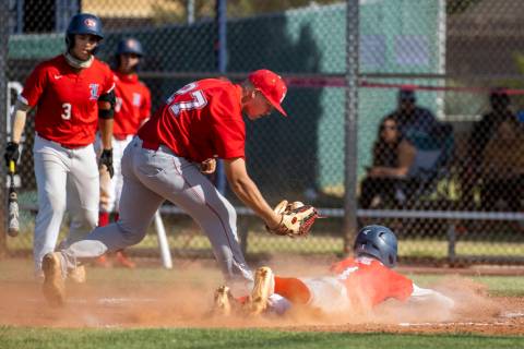 Arbor View pitcher Braxton Bybee (27) is late on the tag at home plate as Liberty runner Bret M ...