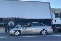 A box truck came to rest on top of a car on U.S. Highway 95 during a two-vehicle collision in t ...
