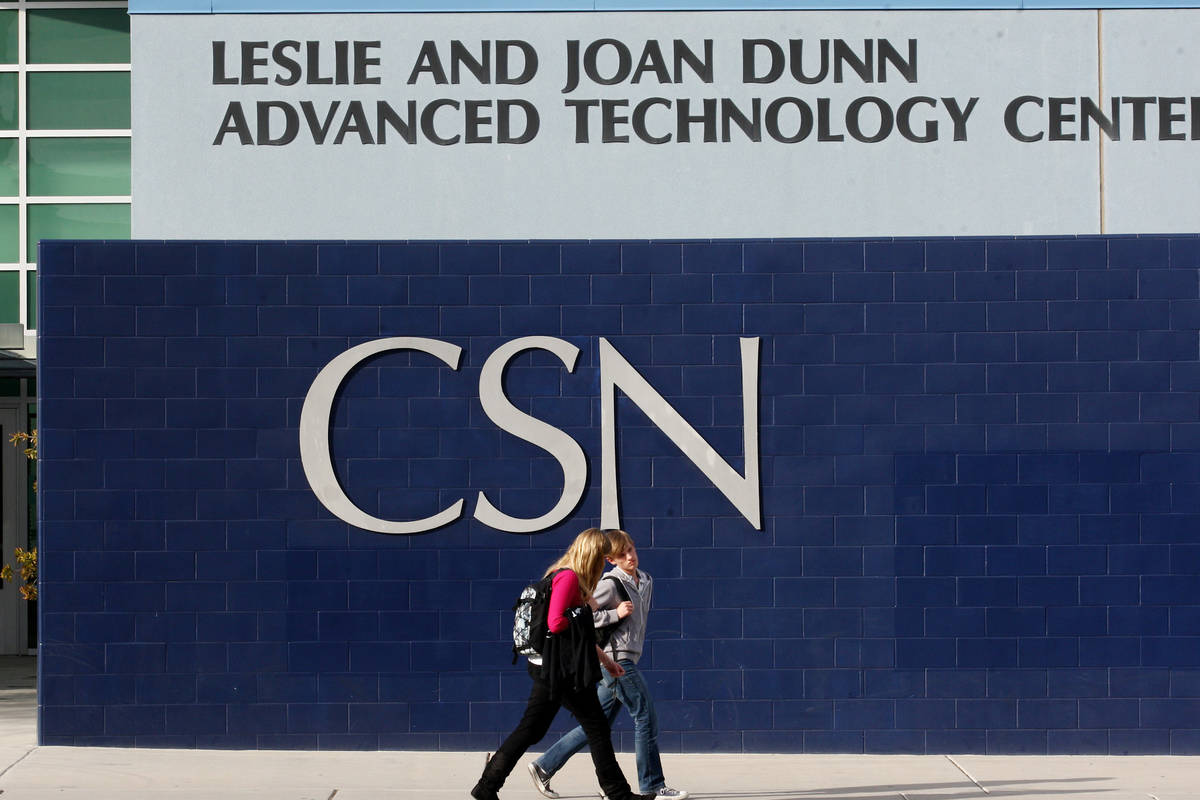 Students walk past the Leslie and Joan Dunn Advance Technology Center at the College of Souther ...