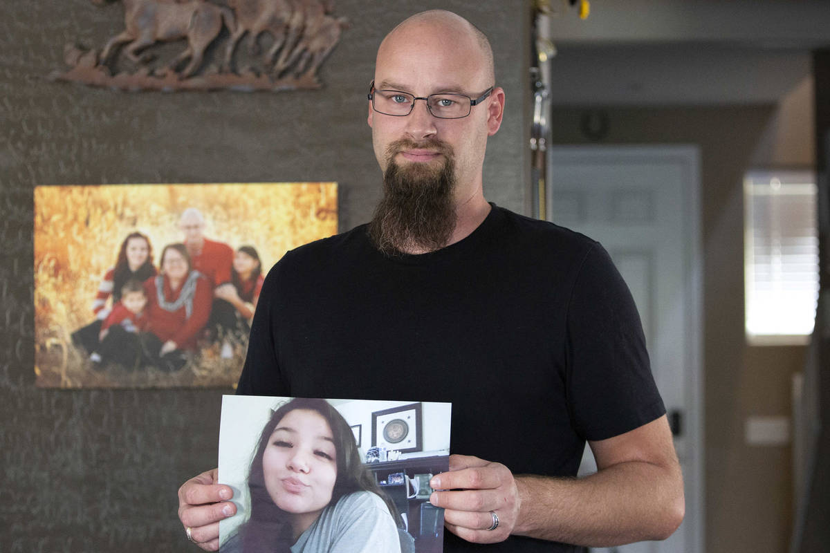 Ross Scheible holds a photo of his daughter, Aleah Scheible, at his home on Friday, May 21, 202 ...