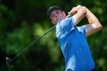 Viktor Hovland watches his tee shot on the seventh hole during the fourth round of the Wells Fa ...
