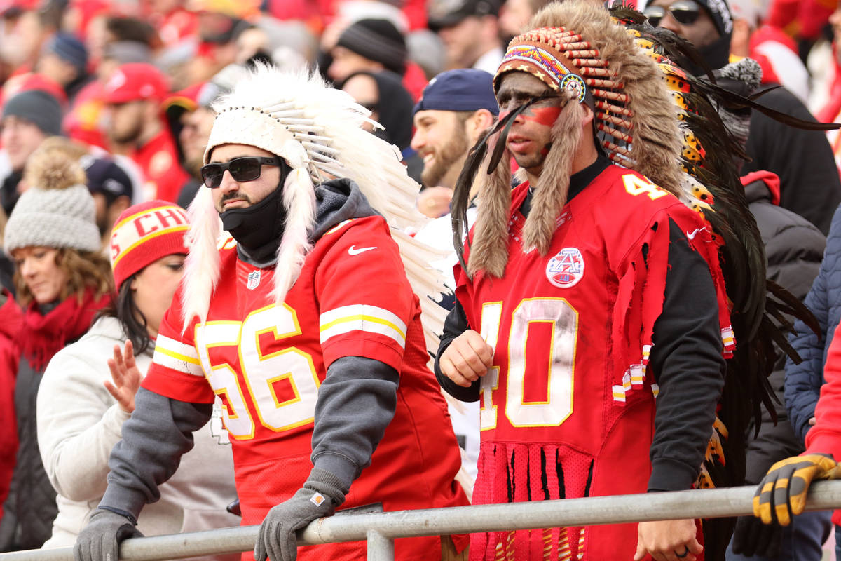 Kansas City Chiefs fans wear headdresses during the first half against the Raiders in Kansas Ci ...