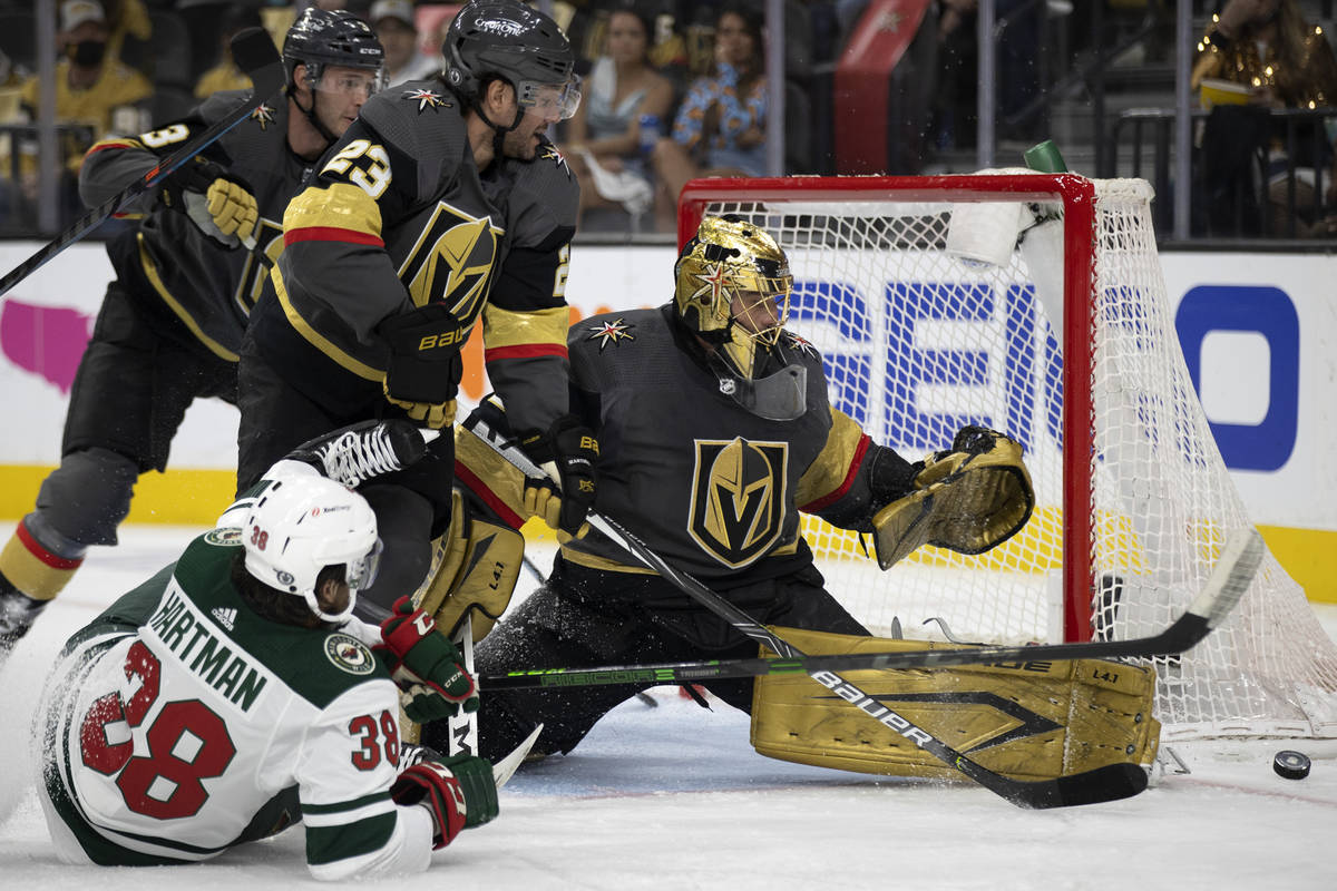 Golden Knights goaltender Marc-Andre Fleury (29) saves a shot on goal by Wild right wing Ryan H ...