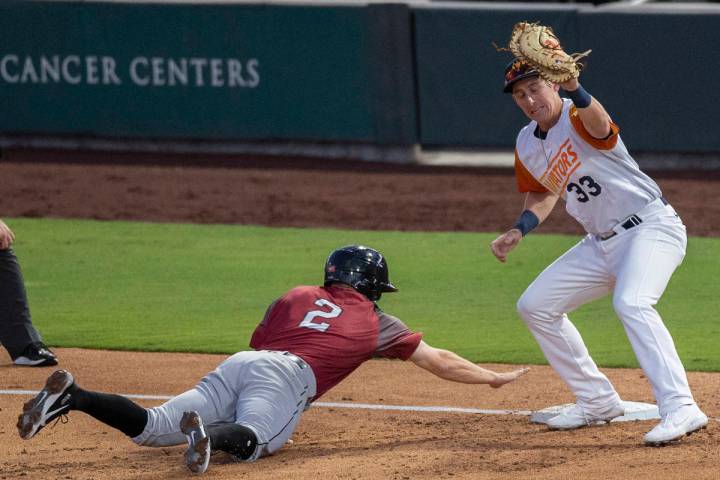 Las Vegas Aviators infielder Frank Schwindel (33) puts the tag on Sacramento River Cats infield ...