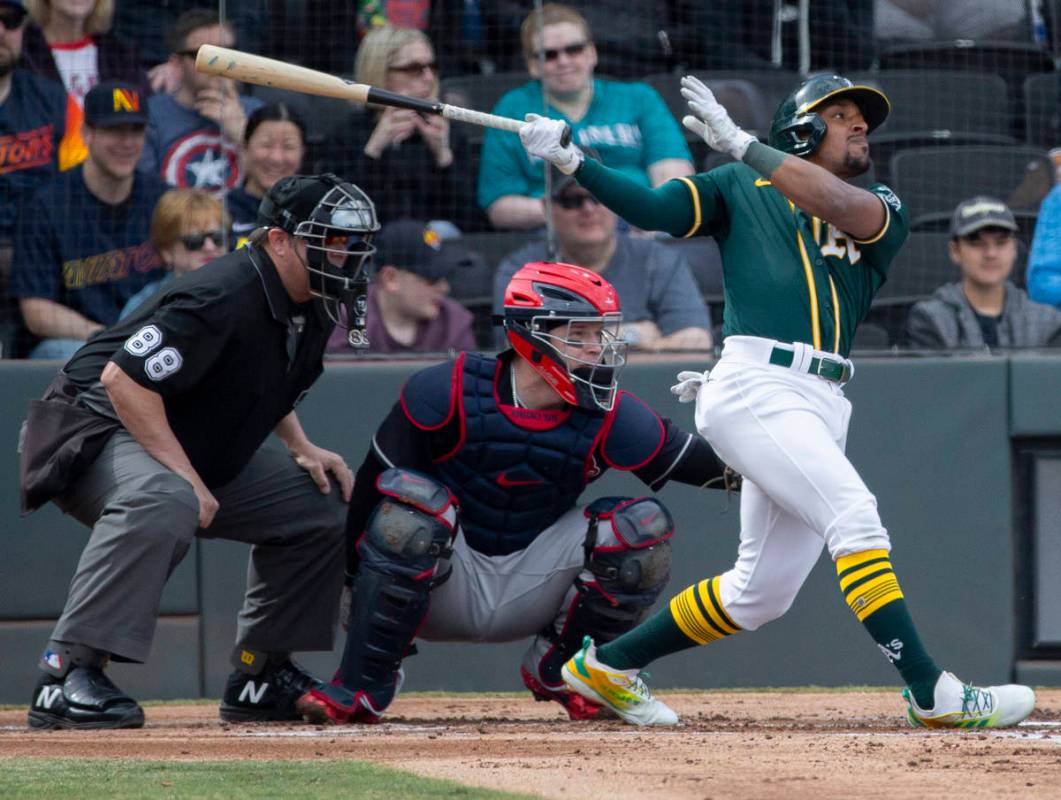 Oakland Athletics second baseman Tony Kemp (5) drives a ball to right field in the second innin ...