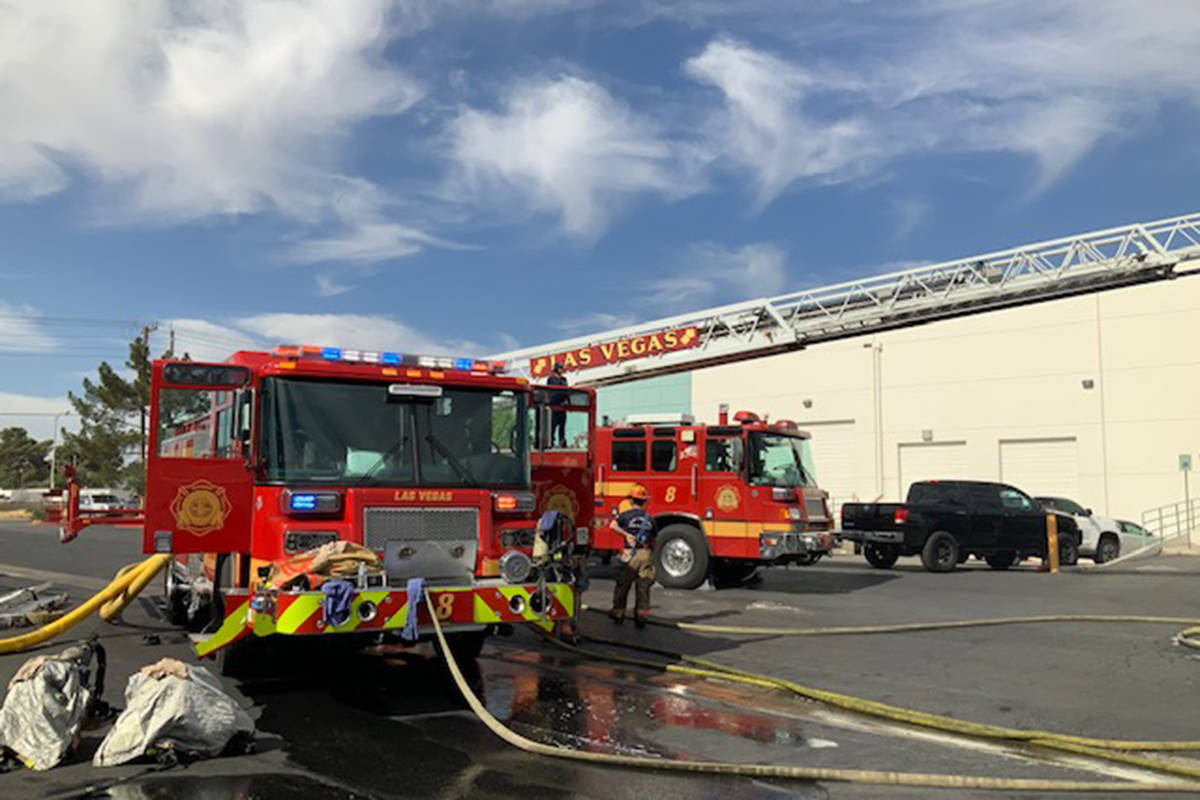 Crews battle a truck fire Wednesday, May 19, 2021, at 3210 E. Charleston Blvd. in Las Vegas. (L ...