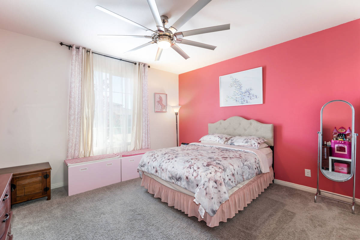 A bedroom at 4601 Amazing View St. (SpotLight Home Tours)