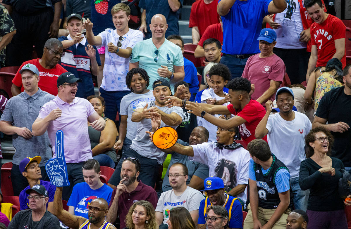 Fans yells for their teams and free merchandise as the Memphis Grizzlies play the New Orleans P ...