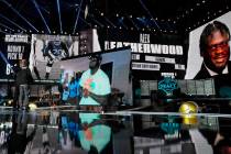 An image of Alabama tackle Alex Leatherwood is displayed on stage after he was chosen by the La ...