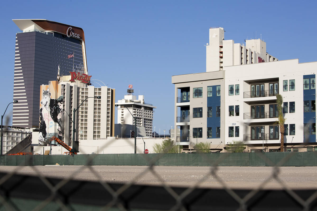 The Auric apartment complex at Symphony Park, right, is seen with the downtown Las Vegas skylin ...