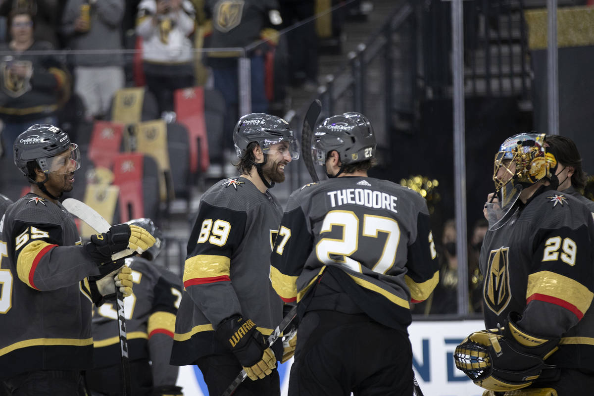 The Golden Knights celebrate their win against the Wild, including right wing Alex Tuch (89), c ...